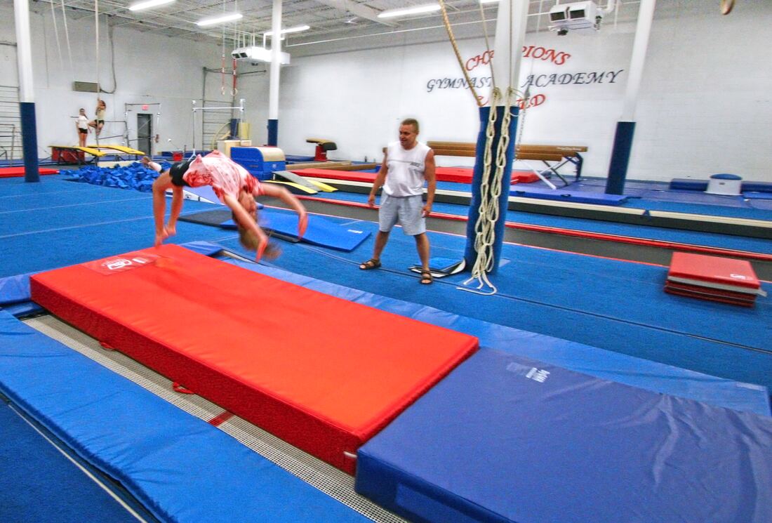 Gymnast tumbling on the spring floor